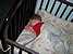 Bryn has started to pull down the bumpers in his crib to get a better view of the world.  Occasionally, it even makes a good pillow.